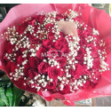 100 red roses with foliage